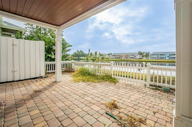 view of patio featuring a water view