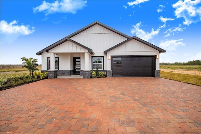 view of front facade with a garage and a porch