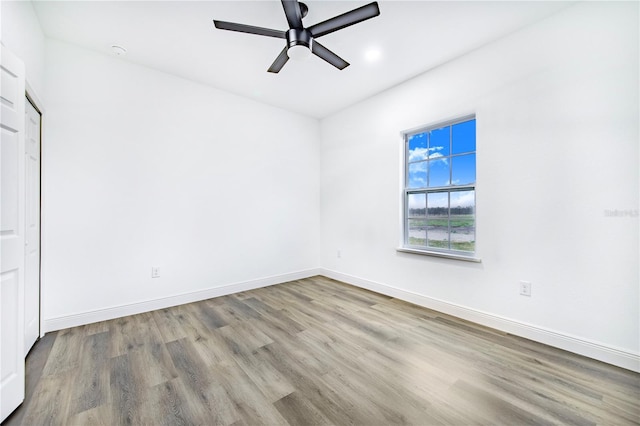 empty room featuring light hardwood / wood-style floors and ceiling fan