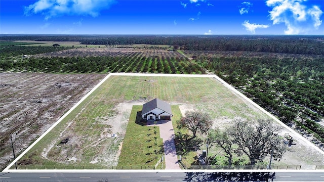 birds eye view of property with a rural view