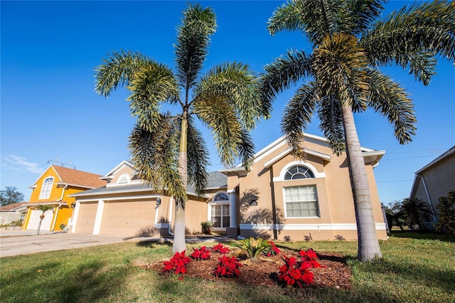 view of front of house with a garage and a front yard