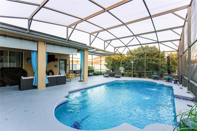 view of swimming pool with a lanai, an outdoor living space, a grill, a patio area, and pool water feature