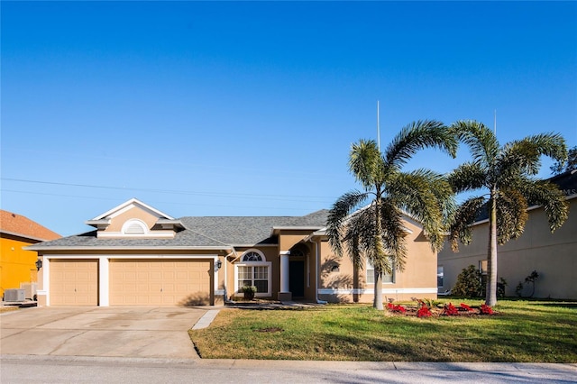 view of front facade featuring a garage, central air condition unit, and a front lawn