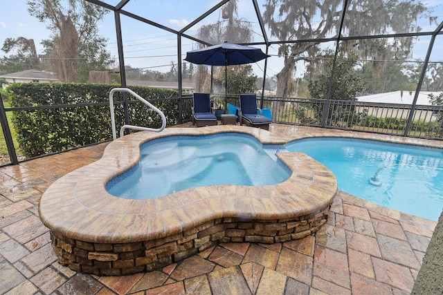 view of swimming pool with glass enclosure and a patio area