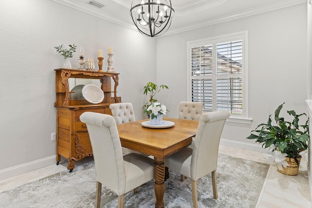 dining area featuring crown molding, a tray ceiling, a chandelier, and light tile patterned flooring