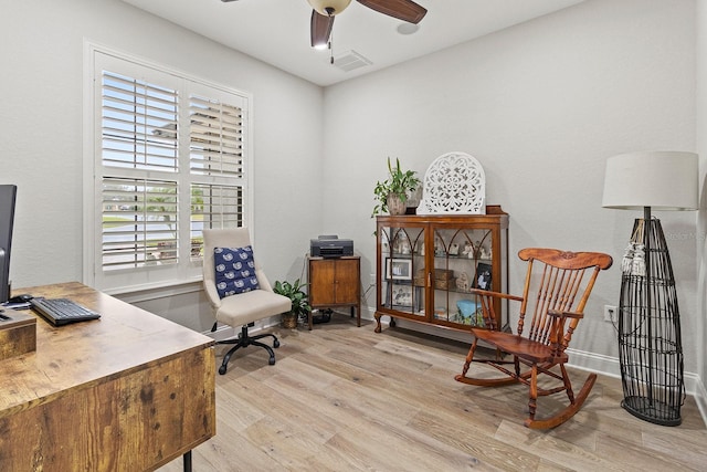 office with ceiling fan and light wood-type flooring