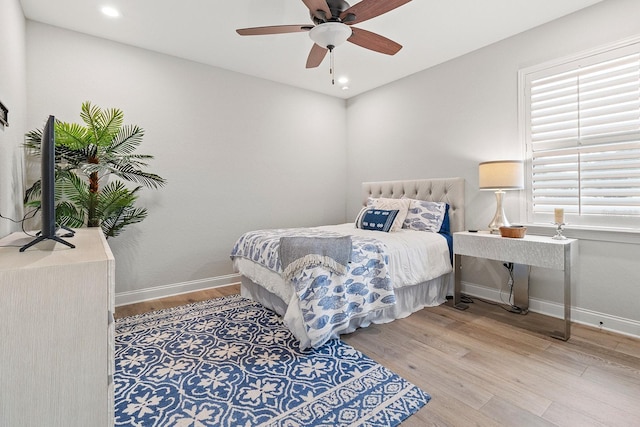 bedroom featuring ceiling fan and light hardwood / wood-style flooring