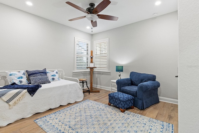 bedroom with hardwood / wood-style floors and ceiling fan