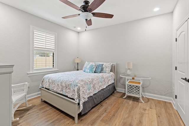 bedroom featuring ceiling fan and light wood-type flooring