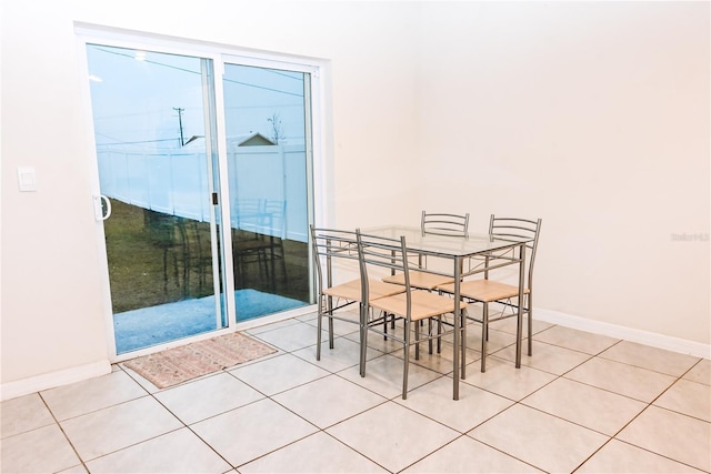 dining space with light tile patterned floors