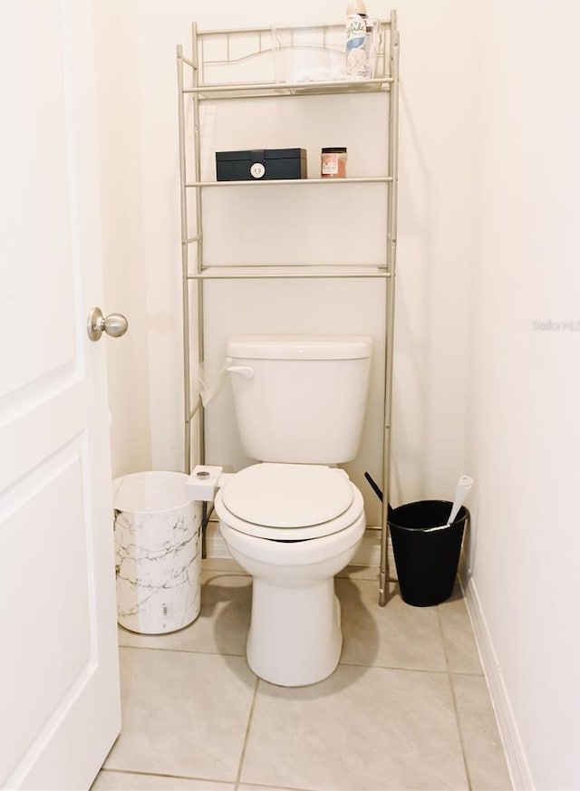 bathroom featuring tile patterned flooring and toilet