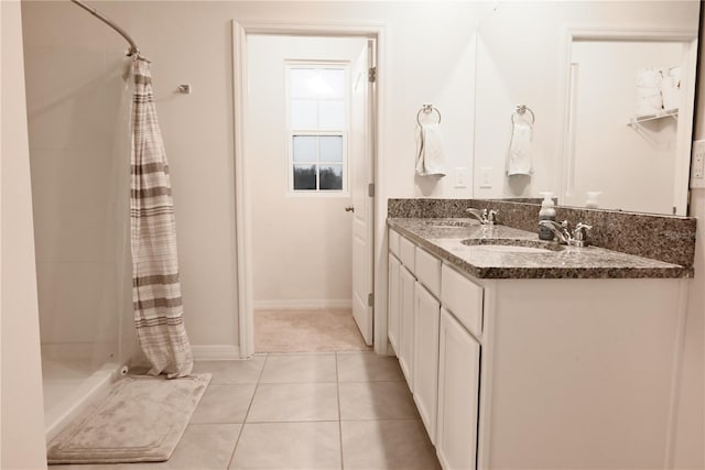 bathroom featuring vanity, curtained shower, and tile patterned floors