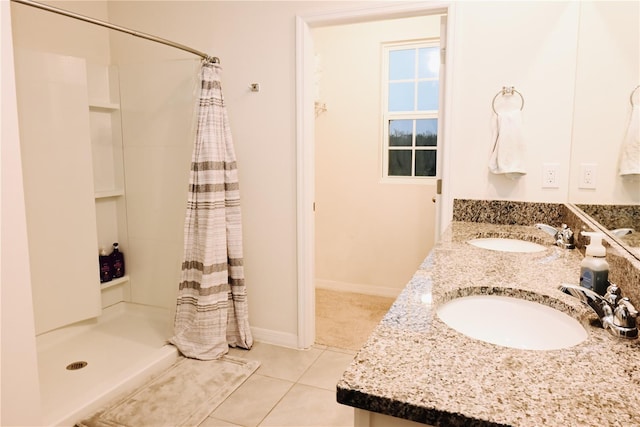 bathroom with tile patterned flooring, vanity, and a shower with curtain