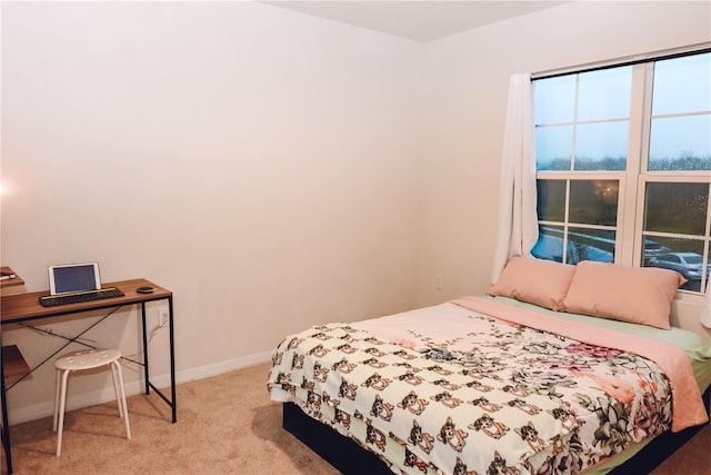 bedroom featuring light colored carpet