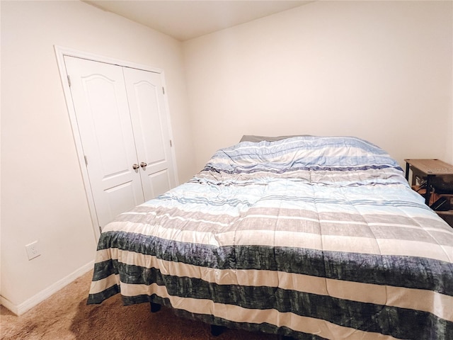 bedroom with a closet and carpet flooring