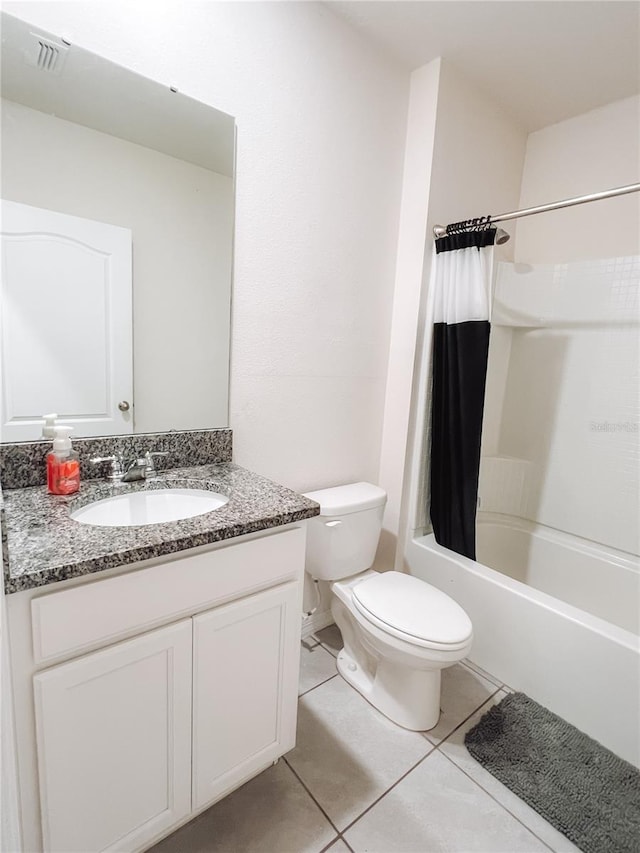 full bathroom with vanity, toilet, tile patterned flooring, and shower / bath combo with shower curtain