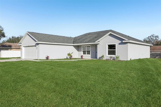 ranch-style home featuring a garage and a front lawn