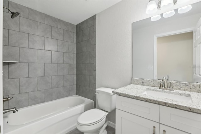 full bathroom featuring vanity, toilet, and tiled shower / bath combo