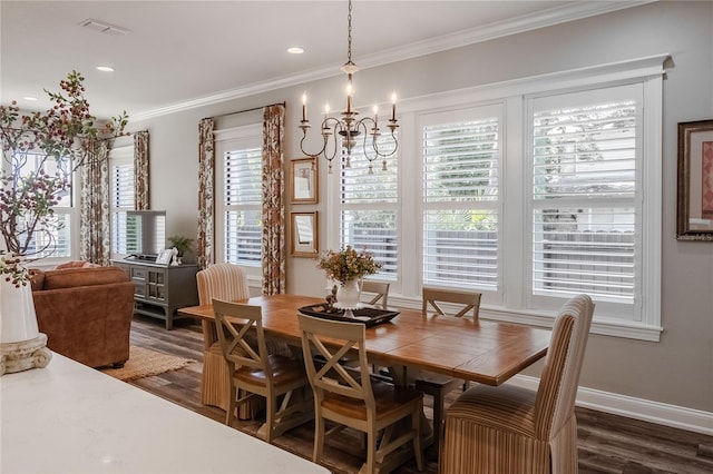 dining space featuring ornamental molding, dark hardwood / wood-style floors, and a notable chandelier