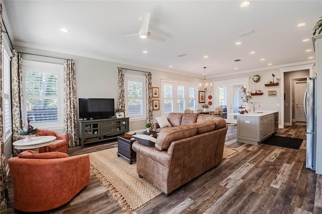 living room featuring ornamental molding, dark hardwood / wood-style floors, and sink