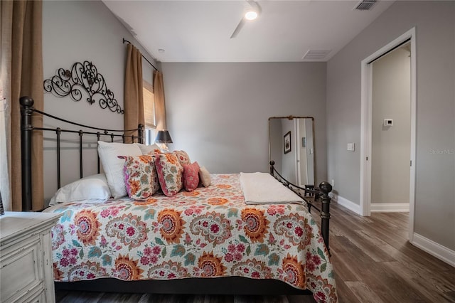 bedroom featuring ceiling fan and wood-type flooring