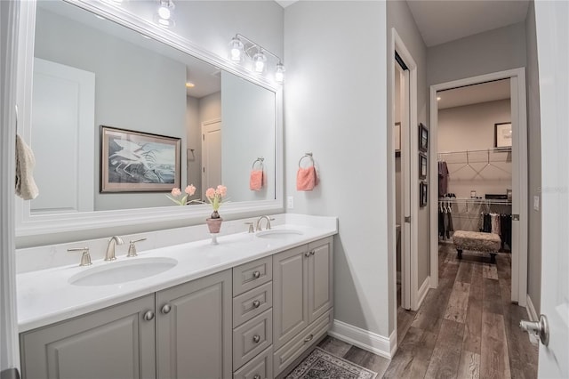 bathroom featuring hardwood / wood-style flooring and vanity