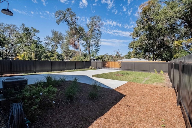 view of yard featuring a patio and central air condition unit