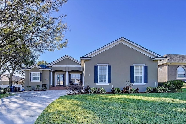 single story home featuring a front yard