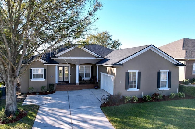 ranch-style house with a garage and a front yard