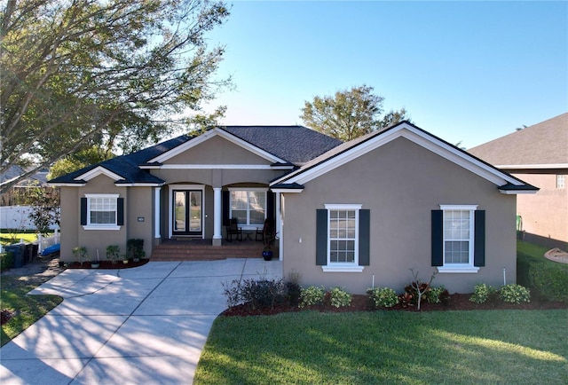 single story home featuring a front yard and a porch