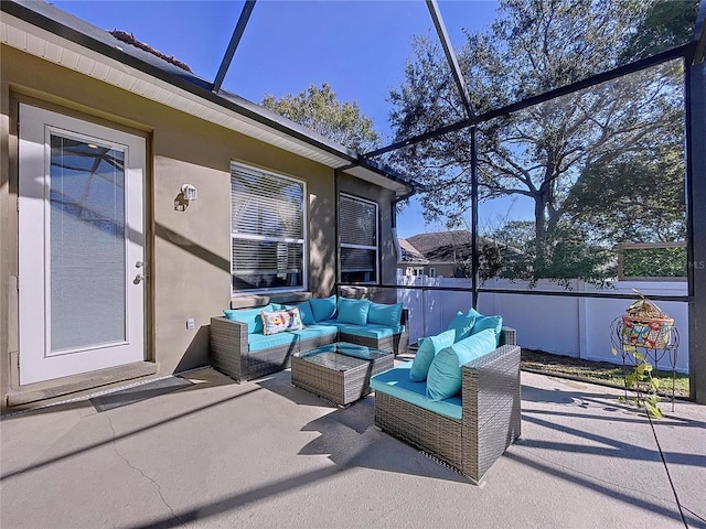 view of patio / terrace with an outdoor hangout area and glass enclosure