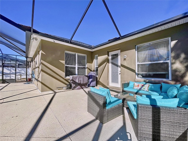 view of patio with an outdoor living space and a lanai