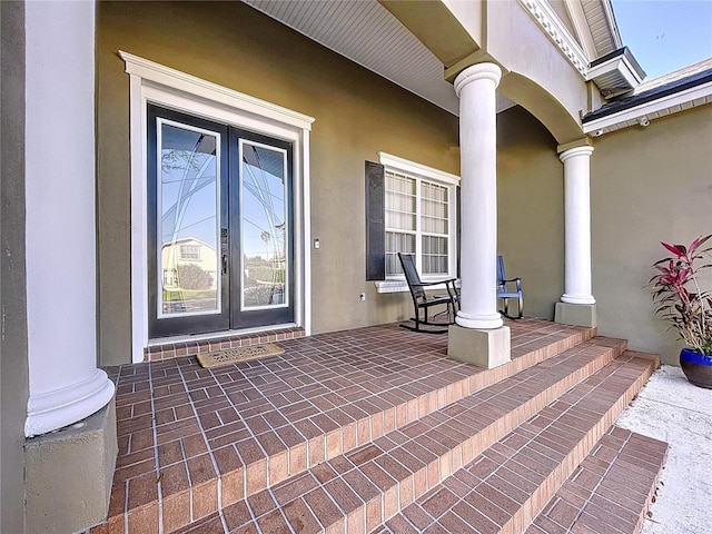 doorway to property with french doors and covered porch