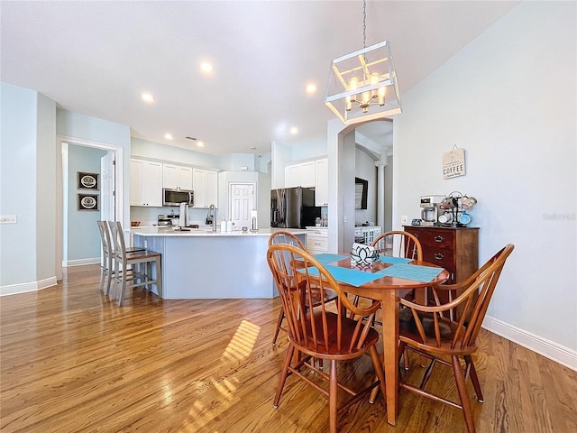 dining area featuring light wood-type flooring