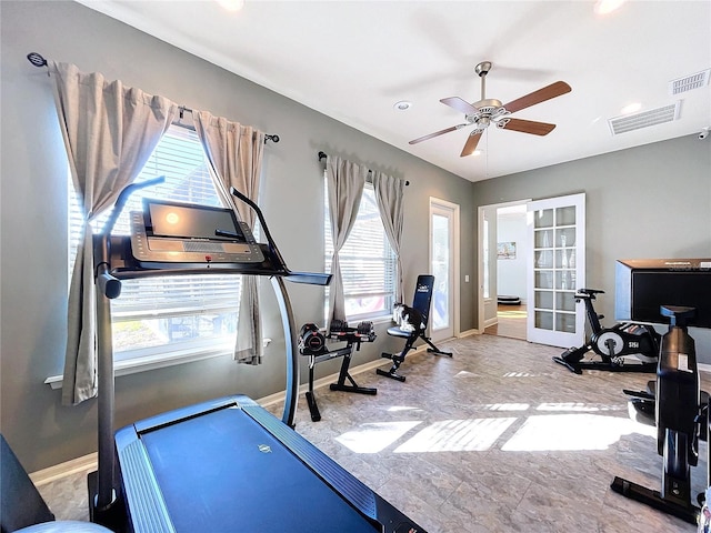 exercise area with french doors and ceiling fan