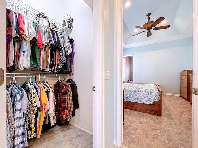 walk in closet featuring ceiling fan