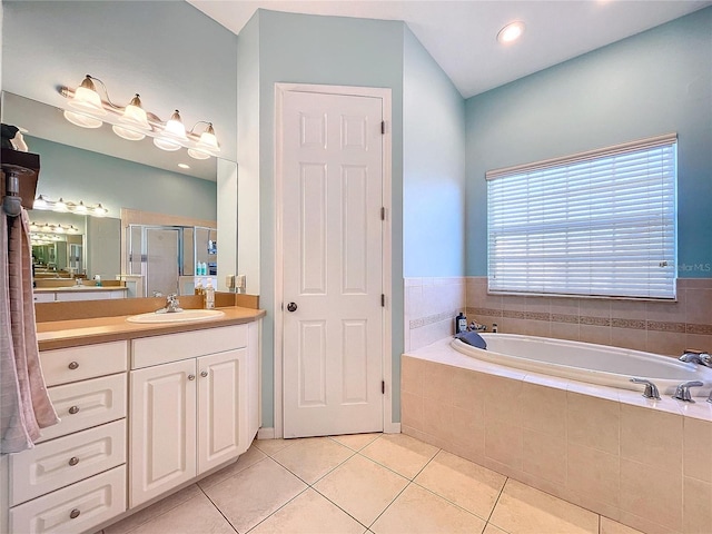 bathroom with vanity, tile patterned floors, and separate shower and tub