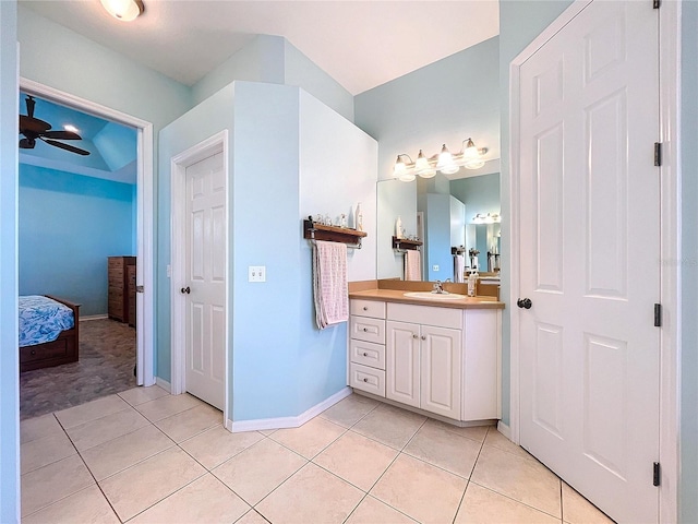 bathroom with ceiling fan, vanity, and tile patterned flooring