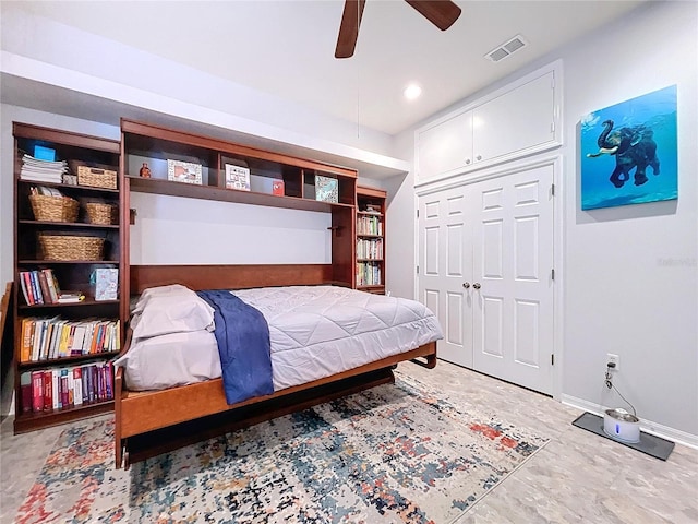 bedroom featuring ceiling fan and a closet