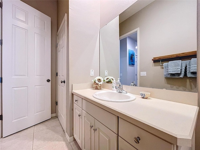 bathroom with tile patterned flooring and vanity