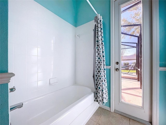 bathroom featuring shower / bath combination with curtain, tile patterned floors, and plenty of natural light