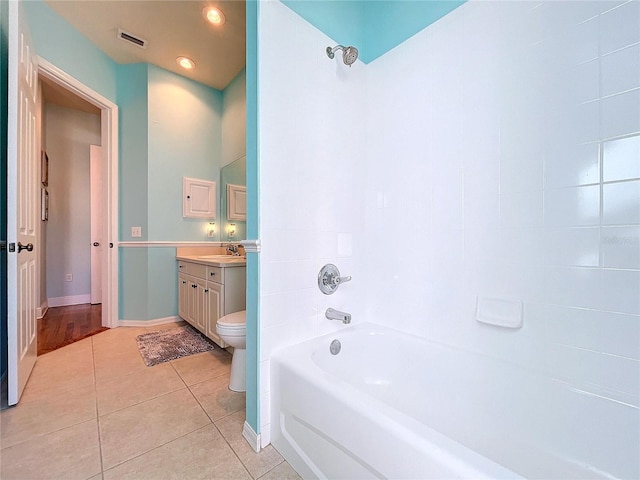 full bathroom featuring tile patterned floors, toilet, shower / bath combination, and vanity