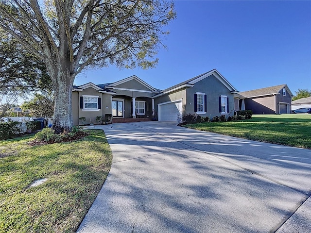 ranch-style house with a garage and a front yard