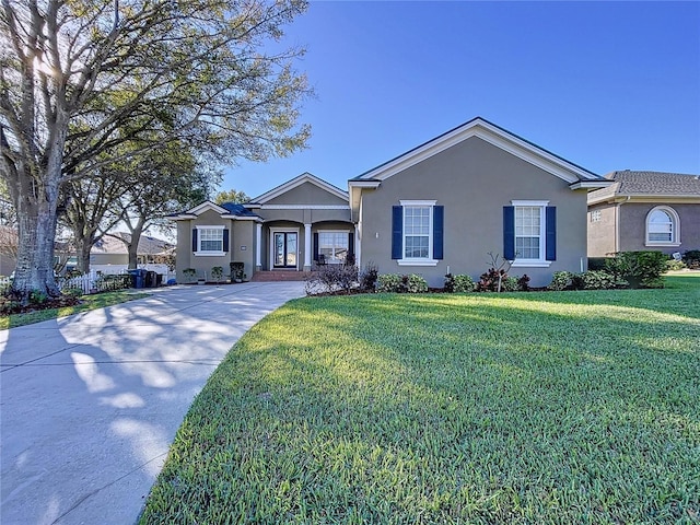 ranch-style home featuring a front yard