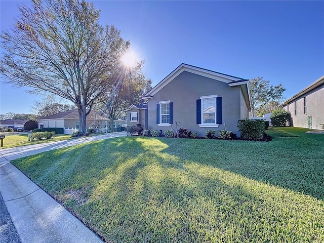 view of property exterior featuring a lawn