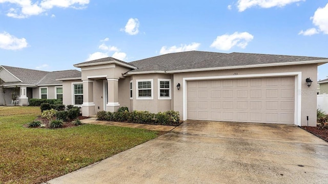 prairie-style house with a garage and a front yard