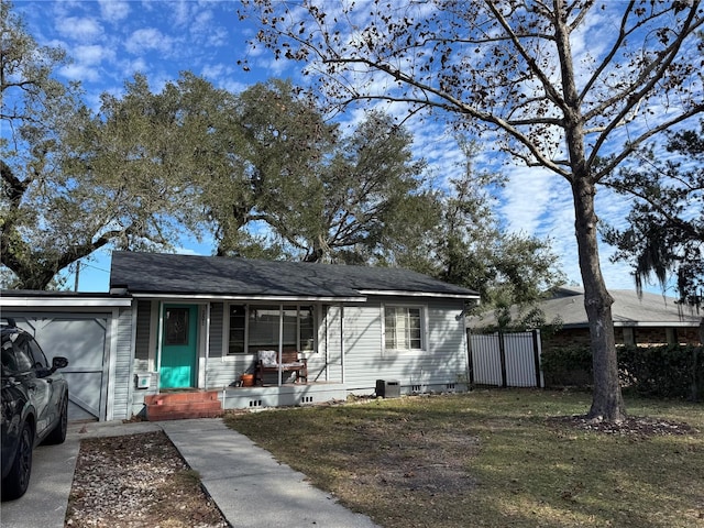 single story home with covered porch and a front yard