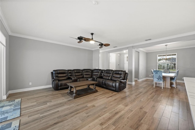 living room with crown molding and light hardwood / wood-style flooring