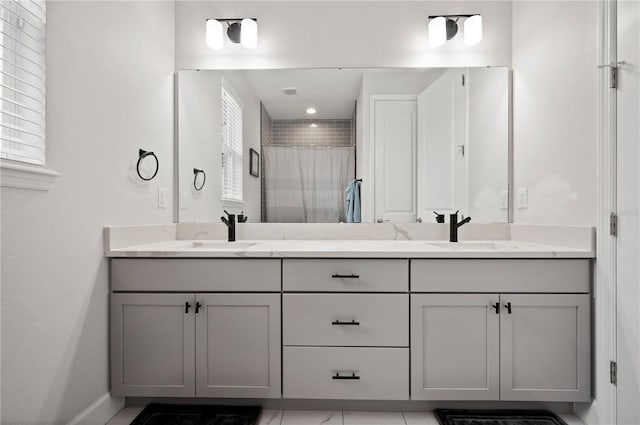 bathroom with vanity and curtained shower