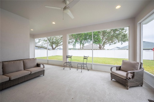 sunroom with ceiling fan